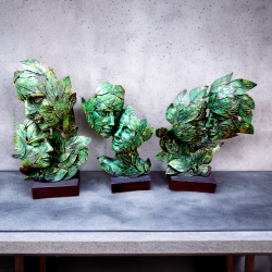 Verdant Visions – Green Leaf Face Sculptures
